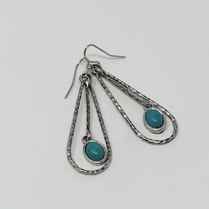 Silver dangle earrings.